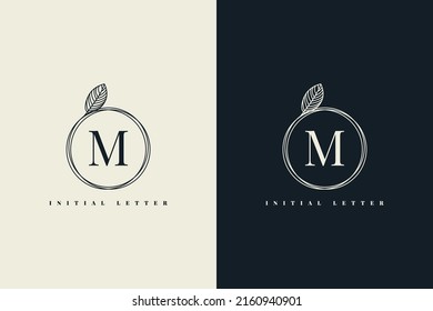 Letter M logo label with vintage leaf frame template design. Vector Eps 10