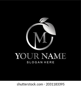 letter M logo and leaf circle. premium vector letter M with silver luxury color leaf. letter M metal model