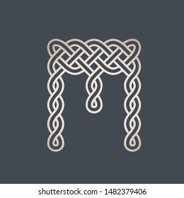 Letter M logo.Celtic knot.Intertwined lines typographic icon.Lettering sign.Alphabet initial in shiny golden metallic color isolated on dark background.Ornamental sign.Luxury style character design.