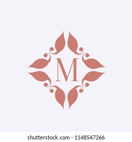 Letter M logo.Elegant initial icon with decorative frame isolated on rose color background.Vector shape lettering.