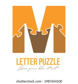 Letter M is made up of puzzles. Vector illustration for logo, brand logo, sticker or scrapbooking, for education. Simple style.
