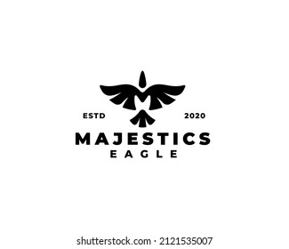 Letter M majestic eagle logo design. Flying eagle silhouette logo