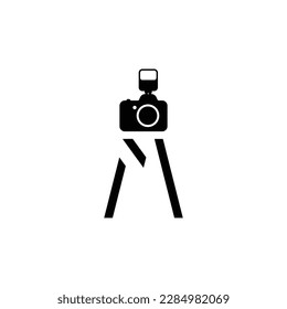 Letter M shaped into a camera and the tripod.