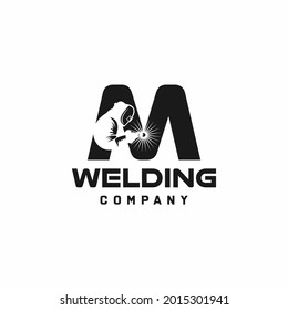 Letter M welding logo, welder silhouette working with weld helmet in simple and modern design style