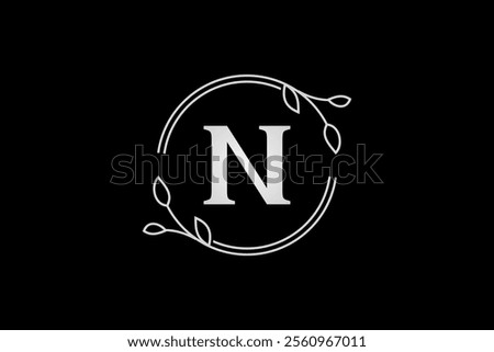 letter n with circle branches and leaves frame elegant luxury logo