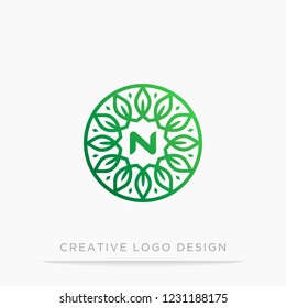 letter N with circle leaf logo design for nature brand.