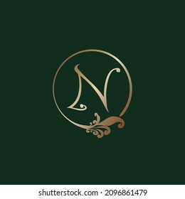 Letter N Decorative Alphabet Logo isolated on green Background. Luxury gold ring Initial Logo Design Template. Elegant Curl Floral Logo Concept. EPS 10 File Project