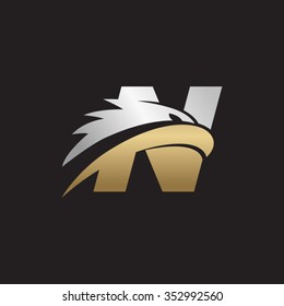 letter N eagle head silver gold logo black background
