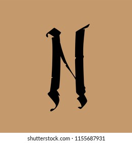 Letter N, in the Gothic style. Vector. Alphabet. The symbol is isolated on a golden background. Calligraphy and lettering. Medieval Latin letter. Logo for the company. Elegant font for tattoo.