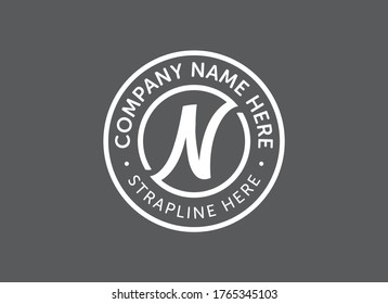 Letter N logo in a circle. White on grey. Vector logo