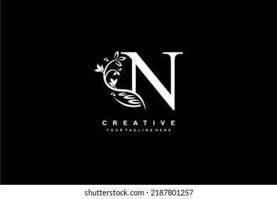 letter N logo design with flowers, leaves and feathers in a beautiful and elegant style. monogram N. typography N. initial N logo. suitable for, business, wedding, boutique, company, hotel, etc