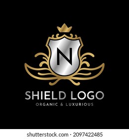 letter N shield gold and silver luxury vector logo design