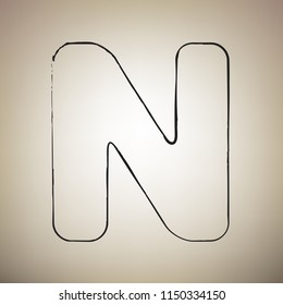 Letter N sign design template element. Vector. Brush drawed black icon at light brown background.