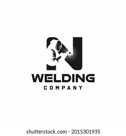 Letter N welding logo, welder silhouette working with weld helmet in simple and modern design style