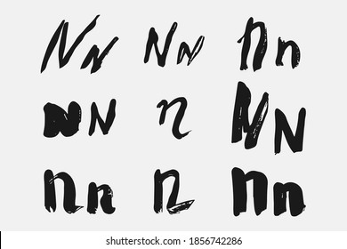 Letter N written by hand. Black letter N written in grunge calligraphy. Different versions of the font are hand-drawn in a careless style. Vector eps illustration.