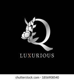 letter Q flower leaves decoration for wedding, beauty care logo, personal branding identity, make up artist or any other royal brand and company. luxurious gold and silver color sample in dummy text