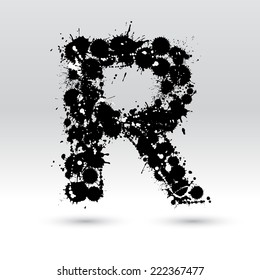 Letter R formed by black and white ink blots