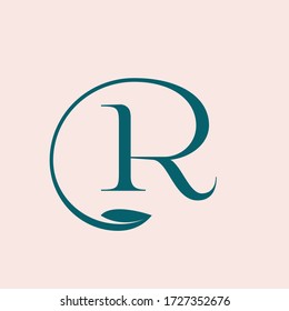 Letter R logo.Typographic icon isolated on light pink background. Serif lettering sign with leaf shape. Green uppercase alphabet initial.Luxury, fresh, elegant, organic, natural style calligraphy.