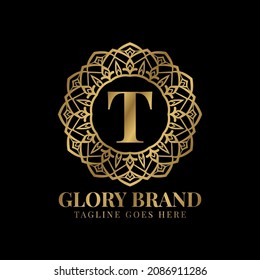 letter T glory mandala vintage golden color luxury vector logo design
