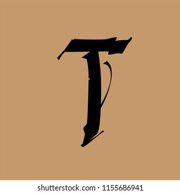 Letter T, in the Gothic style. Vector. Alphabet. The symbol is isolated on a golden background. Calligraphy and lettering. Medieval Latin letter. Logo for the company.  Elegant font for tattoo.