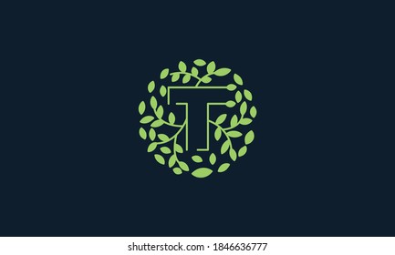Letter T with leaf green garden nature ornament  logo vector icon  design 
