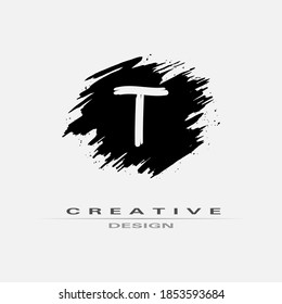 Letter T Logo With Brush Stroke and Splatter Elements. Handwritten Brush Stroke letter T logo design. Creative template suitable for company, logotype, emblem, monogram, jewelry, cosmetic, brand name.