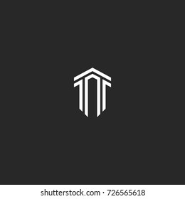 Letter T logo monogram combination of two letters TT parallel lines shape an isometric form of a shield, a creative idea a modern emblem, hipster typography design element