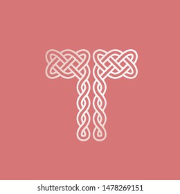 Letter T logo.Ornamental typographic icon.Celtic knots.Lettering sign.Golden metallic alphabet initial isolated on coral color background.Decorative, ancient intertwined lines art.Elegant style.