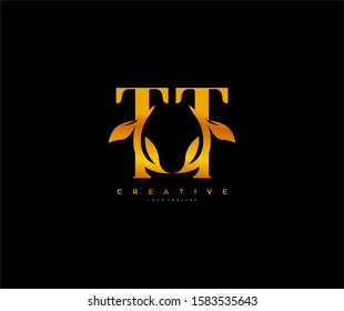 Letter TT Linked Monogram Nature Gold Leaf Logotype Black Background