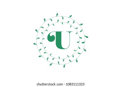 Letter U logo with round green leaves. Elegant floral monogram template design