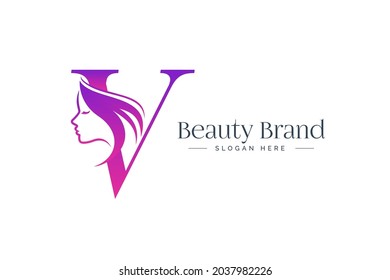 Letter V beauty logo design. Woman face silhouette isolated on letter V.