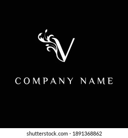 letter V  floral logo on black background