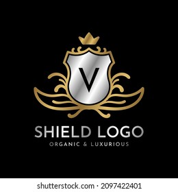 letra V blindaje oro y plata diseño del logotipo vectorial de lujo