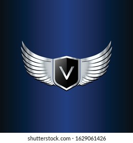 letter V shield with wings gold color logo design concept template vector 3d heraldic shield and wings logo gold / silver emblem