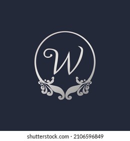 Letter W Decorative Crown Ring Alphabet Logo isolated on Navy Blue Background. Luxury Silver Initial Abjad Logo Design Template. Elegant Curl Floral Logo Concept. EPS 10 File Project