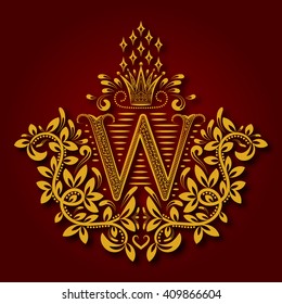 Letter W heraldic monogram in coats of arms form. Vintage golden logo with shadow on maroon background. Letter W is surrounded by floral elements of design.