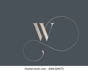 Letter W logo.Calligraphic signature icon.Decorative swirl lettering sign isolated on dark background.Alphabet initial.Elegant, luxury, wedding, beauty, spa style.Gold color.