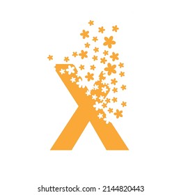 The letter X dissolves into a cloud of flowers.