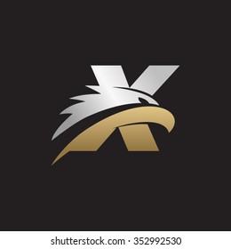letter X eagle head silver gold logo black background