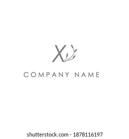 letter X and flower logo on white background