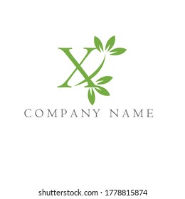 the letter X logo and the leaves