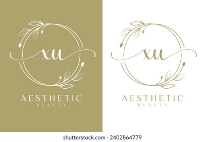 Letter XU Beauty Logo mit floralem Ornament