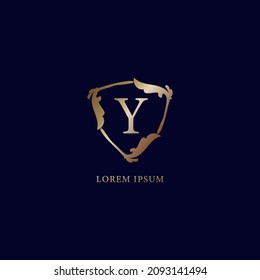 Letter Y Alphabet logo design template. Decorative floral shield sign illustration. Luxury metallic gold security logo concept. isolated on navy blue background