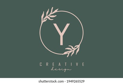 Letter Y Logo with circle frame and pastel leaves design. Rounded vector illustration with letter Y and pastel leaf for beauty, fashion, jewelry, luxury, natural products or eco services.