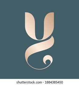 Letter Y logo.Decorative creative typographic icon isolated on dark background.Ornate symbol icon for beauty, fresh, elegant, luxury brand.Alphabet initial.Shiny metallic golden color.