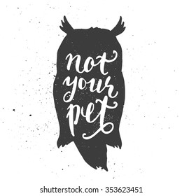 Lettering composition. Phrase Not your pet inscribed into owl silhouette. Ink splashes on white background.