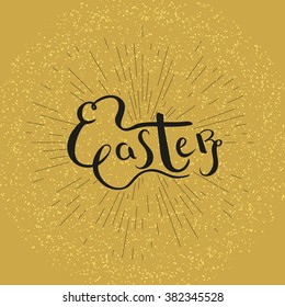 Lettering Easter on golden ray background.