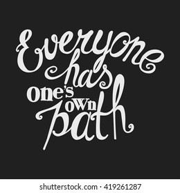 Lettering "Everyone has one's own path". Bright inscription on a dark background.