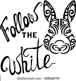 Lettering Follow the White Rabbit with a rabbit head stylized Maori face tattoo.