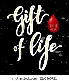 Lettering Gift of life typographic composition with realistic heart on chalkboard.Modern calligraphy. Inscription for world blood donor day. As template of banner, poster, tag, flyer. Motivation quote